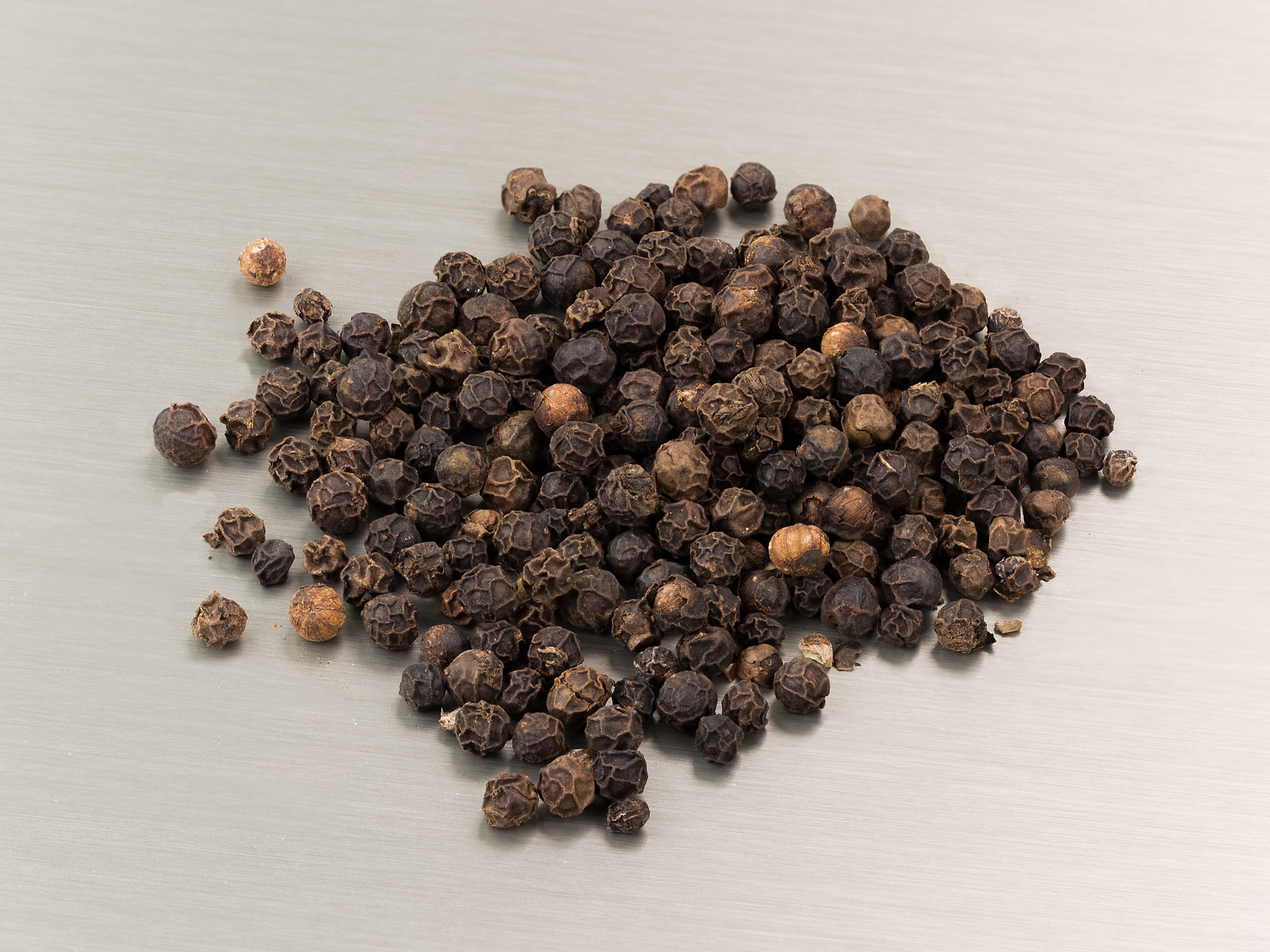 Whole black peppercorns graded for export